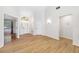 Inviting entryway featuring a bright chandelier, laminate flooring, and ample natural light at 709 47Th E St, Bradenton, FL 34208
