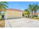 Inviting home featuring a two-car garage and well-maintained landscaping at 709 47Th E St, Bradenton, FL 34208