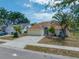 Charming home featuring a well-manicured front yard and a two-car attached garage at 709 47Th E St, Bradenton, FL 34208