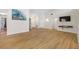 Spacious living room with vaulted ceilings, wood floors, and a modern entertainment center at 709 47Th E St, Bradenton, FL 34208