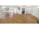 A bright, open-concept living room featuring modern wood-look floors at 709 47Th E St, Bradenton, FL 34208