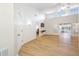 Bright, expansive living room featuring sleek laminate floors, tall ceilings, and neutral paint colors at 709 47Th E St, Bradenton, FL 34208