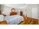 Spacious main bedroom featuring hardwood floors, vaulted ceilings, and view to the living area at 709 47Th E St, Bradenton, FL 34208