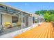 Enclosed porch and outdoor deck overlooking lake at 709 47Th E St, Bradenton, FL 34208