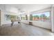 Bright sunroom with tile floors, large windows with a view, and a foosball table at 709 47Th E St, Bradenton, FL 34208
