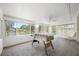 Bright sunroom with tile floors, large windows with a view, and a foosball table at 709 47Th E St, Bradenton, FL 34208