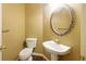 Powder room featuring a pedestal sink and decorative mirror at 7310 Brightwater Oaks Dr, Tampa, FL 33625