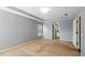 Bright primary bedroom with neutral carpet and abundant natural light at 7310 Brightwater Oaks Dr, Tampa, FL 33625