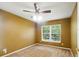 Bedroom showcasing natural light through a window and neutral carpet at 7310 Brightwater Oaks Dr, Tampa, FL 33625