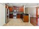 Kitchen featuring stainless steel appliances, wooden cabinets, and a view of the living area at 7310 Brightwater Oaks Dr, Tampa, FL 33625