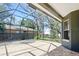 Covered patio with screened-in enclosure and brick floor at 7310 Brightwater Oaks Dr, Tampa, FL 33625