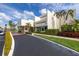 Well-maintained building entrance with lush landscaping, signage and easy access at 7625 Sun Island S Dr # 106, South Pasadena, FL 33707