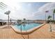 Enjoy this waterfront community pool, complete with lounge chairs and clear blue waters at 7625 Sun Island S Dr # 106, South Pasadena, FL 33707