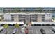 Exterior showcases covered parking, manicured landscaping, and direct access to the building entrance at 7625 Sun Island S Dr # 106, South Pasadena, FL 33707
