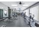 Spacious gym with modern equipment, including weight machines, treadmills, and exercise bikes for a full workout at 7625 Sun Island S Dr # 106, South Pasadena, FL 33707