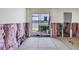 Renovation progress in the living room with insulation exposed and water view at 7625 Sun Island S Dr # 106, South Pasadena, FL 33707