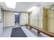 Functional locker room with lockers, a bench, and tiled flooring for secure storage and changing at 7625 Sun Island S Dr # 106, South Pasadena, FL 33707