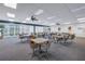 Bright meeting room with ample seating and plenty of natural light from expansive windows at 7625 Sun Island S Dr # 106, South Pasadena, FL 33707