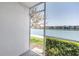 Patio view overlooking the lake with buildings in the distance at 7625 Sun Island S Dr # 106, South Pasadena, FL 33707