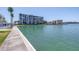 Waterfront view showing buildings and docks at 7625 Sun Island S Dr # 106, South Pasadena, FL 33707