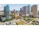 Aerial view showcases high-rise office buildings, and an urban park space, set against a blue sky backdrop at 777 N Ashley Dr # 2603, Tampa, FL 33602