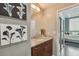 Bathroom view leading to a bedroom with a granite countertop and wood cabinets at 777 N Ashley Dr # 2603, Tampa, FL 33602