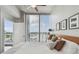Bright bedroom with floor to ceiling windows with access to a balcony at 777 N Ashley Dr # 2603, Tampa, FL 33602