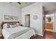 Bedroom with wood floors and decor, connecting to a closet and bathroom at 777 N Ashley Dr # 2603, Tampa, FL 33602