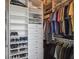 Organized closet features shelving, drawers, and hanging rods for clothes and shoes at 777 N Ashley Dr # 2603, Tampa, FL 33602