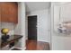 Home entryway showcasing hardwood floors, built-in desk, storage and a sailboat painting at 777 N Ashley Dr # 2603, Tampa, FL 33602