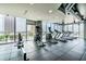 Spacious fitness center featuring modern cardio equipment and floor-to-ceiling windows with city views at 777 N Ashley Dr # 2603, Tampa, FL 33602