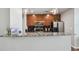 Well-lit kitchen featuring granite countertops, stainless appliances, and dark backsplash at 777 N Ashley Dr # 2603, Tampa, FL 33602