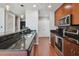 Chic kitchen features wood floors, stainless steel appliances, and stylish pendant lighting at 777 N Ashley Dr # 2603, Tampa, FL 33602