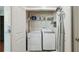 Laundry room with stacked washer and dryer and overhead storage at 777 N Ashley Dr # 2603, Tampa, FL 33602