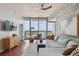 Bright living area featuring modern decor, hardwood floors, and large windows offering stunning city views at 777 N Ashley Dr # 2603, Tampa, FL 33602