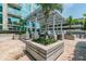Enjoy outdoor grilling in this beautiful lounge area surrounded by lush greenery and tropical palm trees at 777 N Ashley Dr # 2603, Tampa, FL 33602