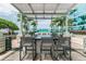 Outdoor grill and bar area featuring stainless steel grills, seating and a pergola for shade and relaxation at 777 N Ashley Dr # 2603, Tampa, FL 33602