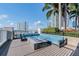 Rooftop lounge area features comfortable seating, a modern fire pit, and city views at 777 N Ashley Dr # 2603, Tampa, FL 33602