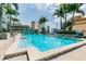 Beautiful community pool surrounded by tropical palm trees at 777 N Ashley Dr # 2603, Tampa, FL 33602