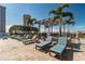 Relaxing rooftop terrace featuring lounge chairs and pergola with lush greenery and city views at 777 N Ashley Dr # 2603, Tampa, FL 33602