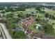 Aerial view showcasing condo complex, lush greenery, and scenic golf course at 8005 Bardmoor Pl # 102I, Seminole, FL 33777