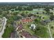 Aerial view of condo complex with golf course, ponds, and mature trees at 8005 Bardmoor Pl # 102I, Seminole, FL 33777