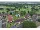 Aerial view of complex featuring a pool, landscaping, and golf course at 8005 Bardmoor Pl # 102I, Seminole, FL 33777