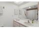 Bright bathroom with a large mirror and a shower curtain at 8005 Bardmoor Pl # 102I, Seminole, FL 33777