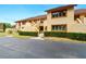Exterior of the two-story condominium featuring well-manicured landscaping at 8005 Bardmoor Pl # 102I, Seminole, FL 33777