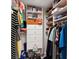 Walk-in closet featuring rods, shelves, drawers, and baskets for optimal storage and organization at 8005 Bardmoor Pl # 102I, Seminole, FL 33777