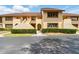 Charming townhouse featuring a well-maintained facade and mature landscaping at 8005 Bardmoor Pl # 102I, Seminole, FL 33777
