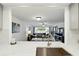 Open-concept living space with view from kitchen, showcasing spacious and bright interior at 8005 Bardmoor Pl # 102I, Seminole, FL 33777