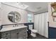 Charming bathroom featuring a marble vanity, modern fixtures, and patterned wallpaper at 820 Hickory Ln, Palm Harbor, FL 34683