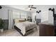 Serene bedroom featuring neutral tones, a comfortable bed, and plenty of natural light at 820 Hickory Ln, Palm Harbor, FL 34683